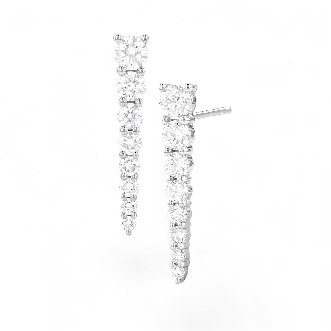 0.76 Ctw Drop White Diamond Modern 18K White Gold Earrings - Certified: Epitomizing grandeur, this stunning Drop pair of earrings featuring Natural Diamonds stands as a beacon of refined taste. A detailed Shared Prong gallery secures the stones, rendered in 1.85 grams of 