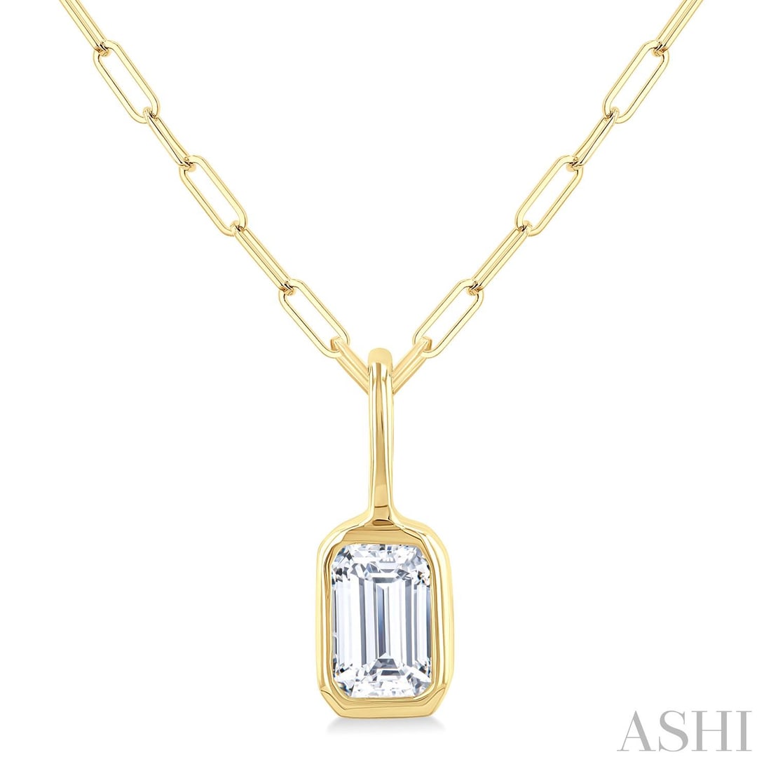 0.21 ctw Emerald Cut Diamond Bezel Set 14K Yellow Gold Pendant Necklace: Defining modern elegance, this stunning Bezel Set necklace featuring White Diamond captures the essence of style. Securely held in a classic Solitaire design, the necklace is forged from 0.23 grams of