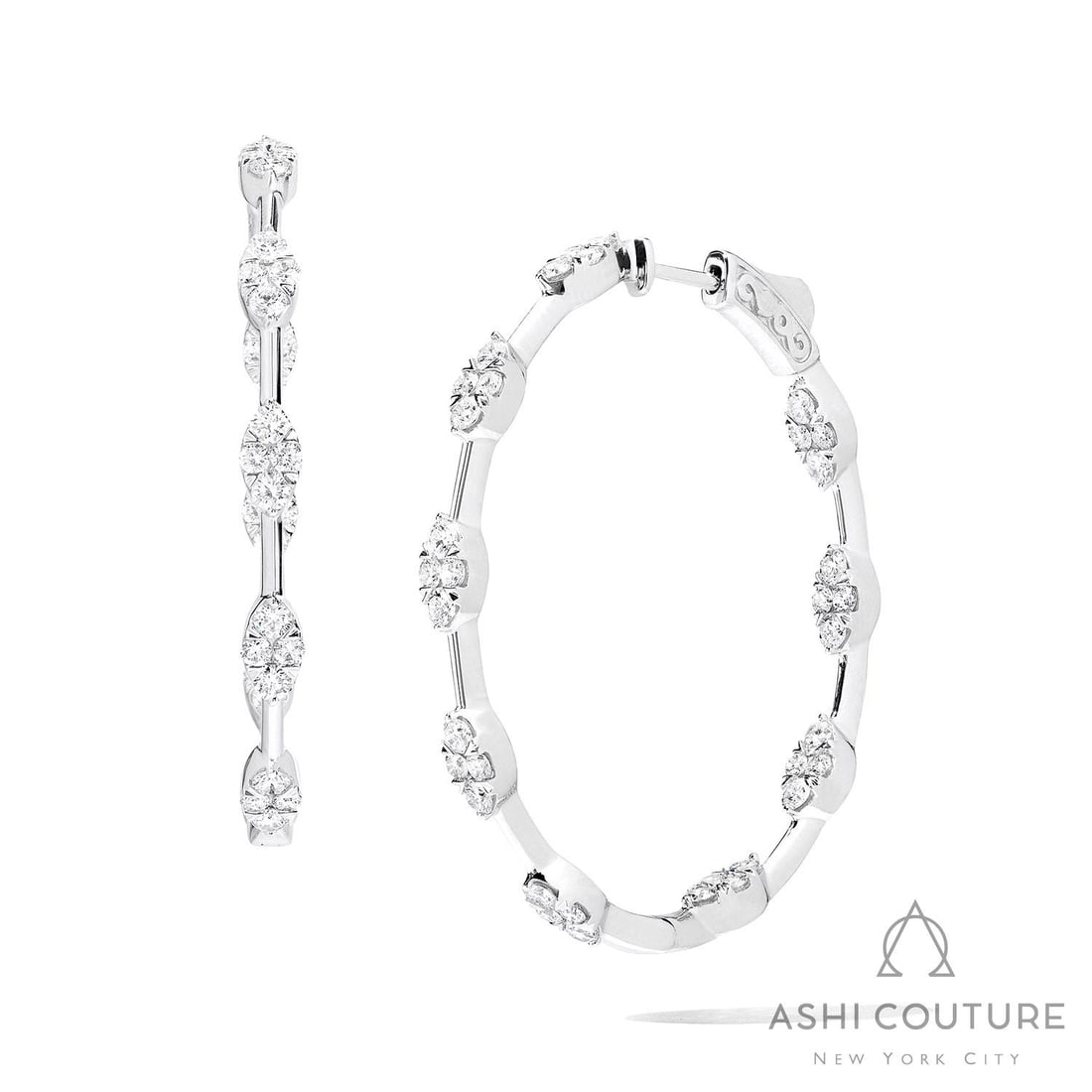 1.96 ctw White Diamond Fiori Cluster Hoop 18K White Gold Earrings: An exquisite masterpiece of haute joaillerie, this breathtaking Fiori Cluster Hoop pair of earrings featuring White Diamond is a true treasure. Crafted with precision, the Cluster setting is seamlessl