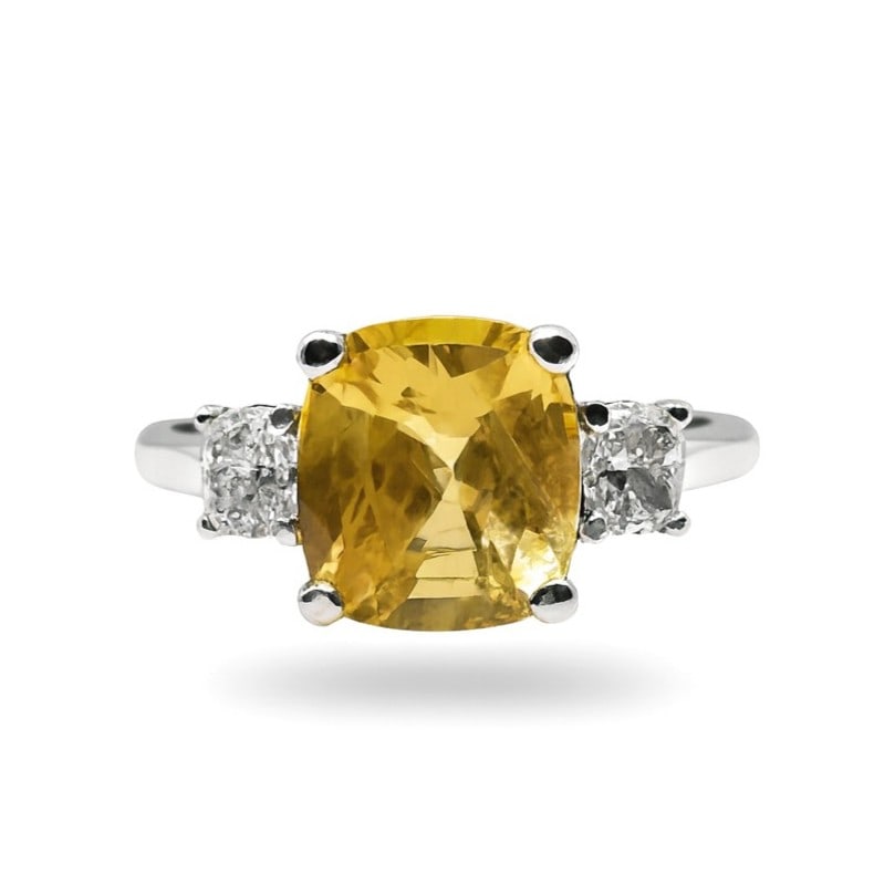 5.18ctw Yellow Sapphire and 0.61ctw White Diamond 14K White Gold Ring: A testament to superior craftsmanship, this magnificent Three Stone ring featuring Yellow Sapphire, White Diamond is unparalleled. Showcasing the gems in a Three-Stone arrangement, the ring consists o