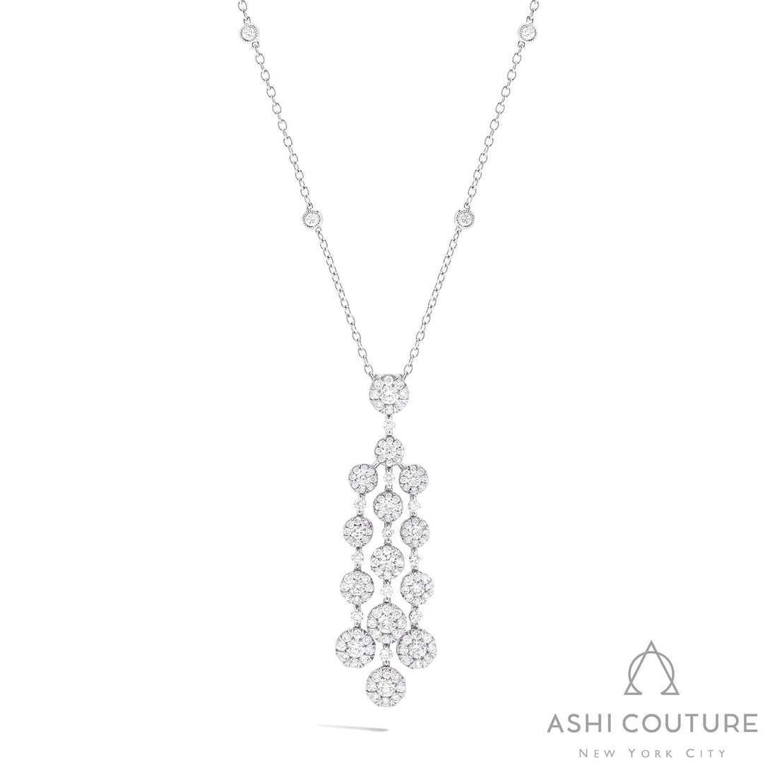 2.37 ctw Fiori Waterfall Cluster Diamond 18K White Gold Pendant: Epitomizing grandeur, this breathtaking Fiori Waterfall Cluster pendant necklace featuring White Diamonds stands as a beacon of refined taste. A detailed Cluster gallery secures the stones, rendered i