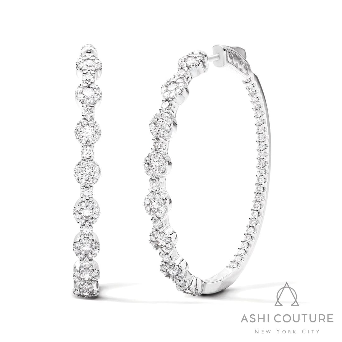 2.05 ctw Fiori Cluster White Diamond 18K White Gold Hoop Earrings: Timeless and sophisticated, this stunning Fiori Station Cluster pair of earrings featuring White Diamond radiates enduring beauty. Expertly mounted in a Cluster setting, the earrings are crafted in 12