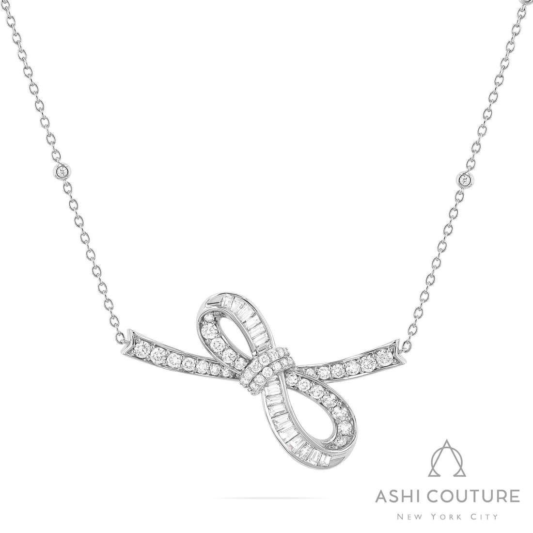 1.96 ctw Baguette & Round Diamond Bow Smile 18K White Gold Pendant Necklace: A vision of luxury, this breathtaking Bow Smile pendant necklace featuring White Diamond defines sophistication. The gemstones are nestled within a Pave/Channel Setting framework, supported by a subst