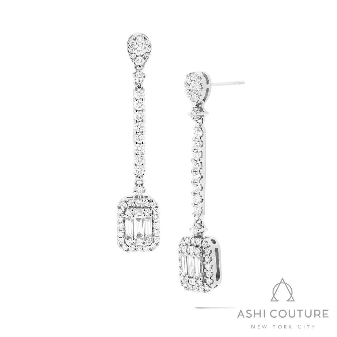 1.33 ctw Baguette and Round Diamond 18K White Gold Drop Earrings: Exuding opulence and grace, this breathtaking Swinging Baguette Drop Cluster pair of earrings featuring White Diamond is crafted for the distinguished. A detailed Cluster/Halo gallery secures the ston