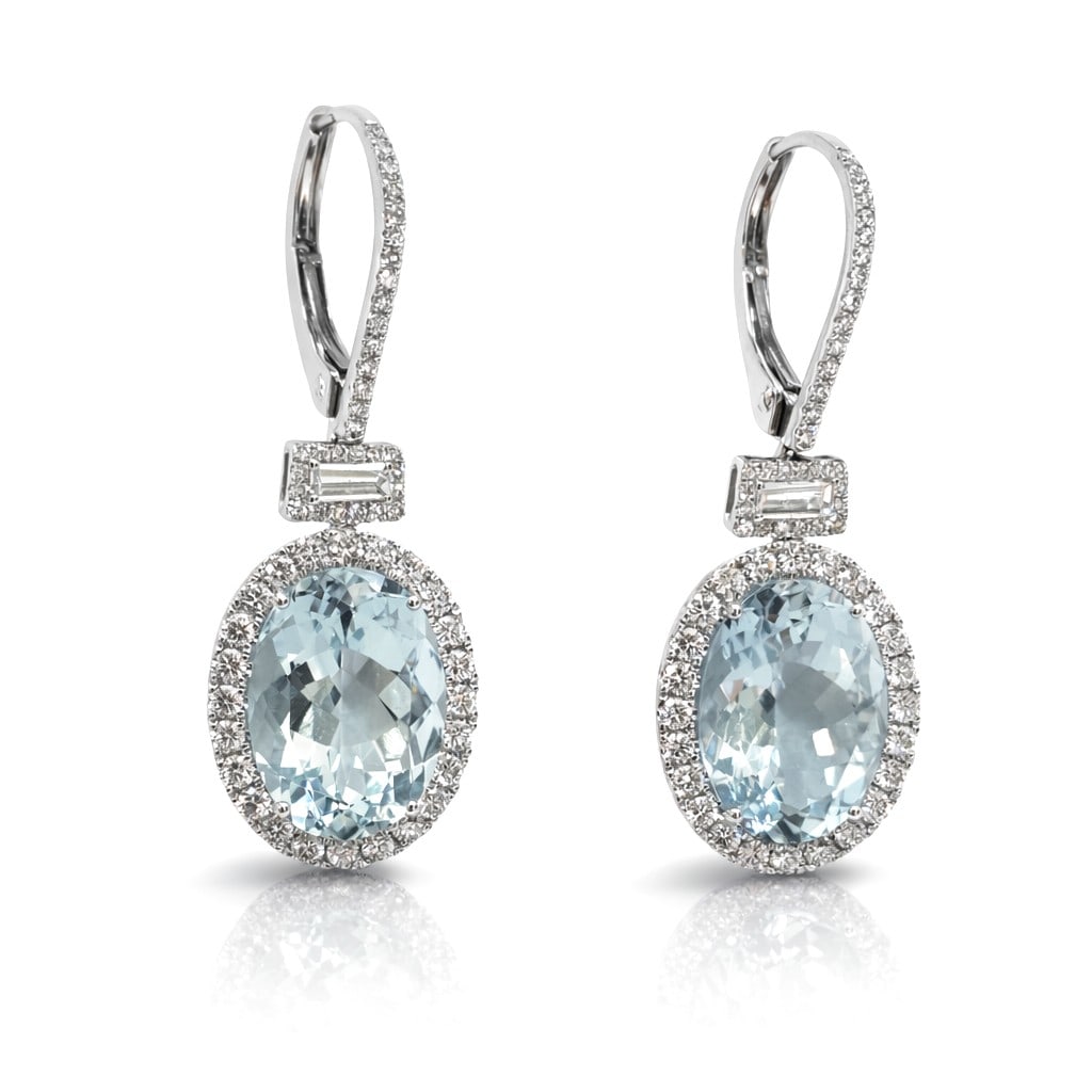 19.30ct Oval Aquamarine and 2.50ctw Diamond 18K White Gold Earrings: A symphony of light and color, this breathtaking Halo pair of earrings featuring Aquamarine, White Diamond embodies the pinnacle of luxury. Securely held in a classic Halo design, the earrings are for