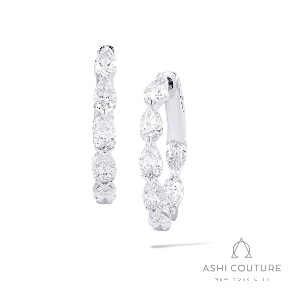 Duchess 2.56 ctw Pear Diamond 18K White Gold Hoop Earrings: Rare and radiant, this stunning Pear Hoops pair of earrings featuring White Diamond offers a touch of the extraordinary. Showcasing the gems in a Continuous Line arrangement, the earrings consists of 