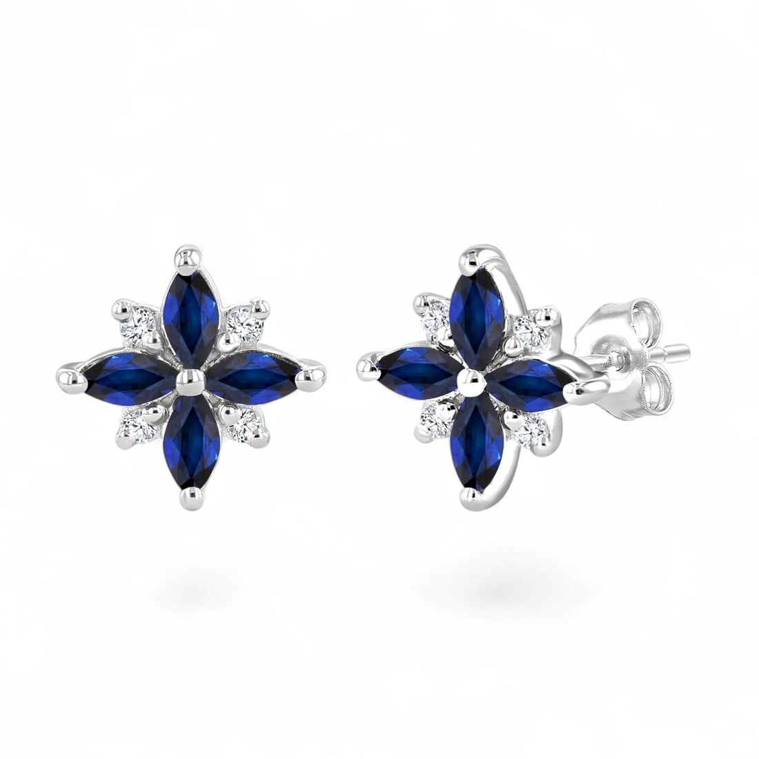 4x2 MM Blue Sapphire and 0.08 Ctw Blossom White Diamond Modern 10K White Gold Earrings - Certified: A testament to superior craftsmanship, this stunning Blossom pair of earrings featuring Natural Diamonds and Sapphires is unparalleled. Crafted with precision, the Cluster setting is seamlessly integr