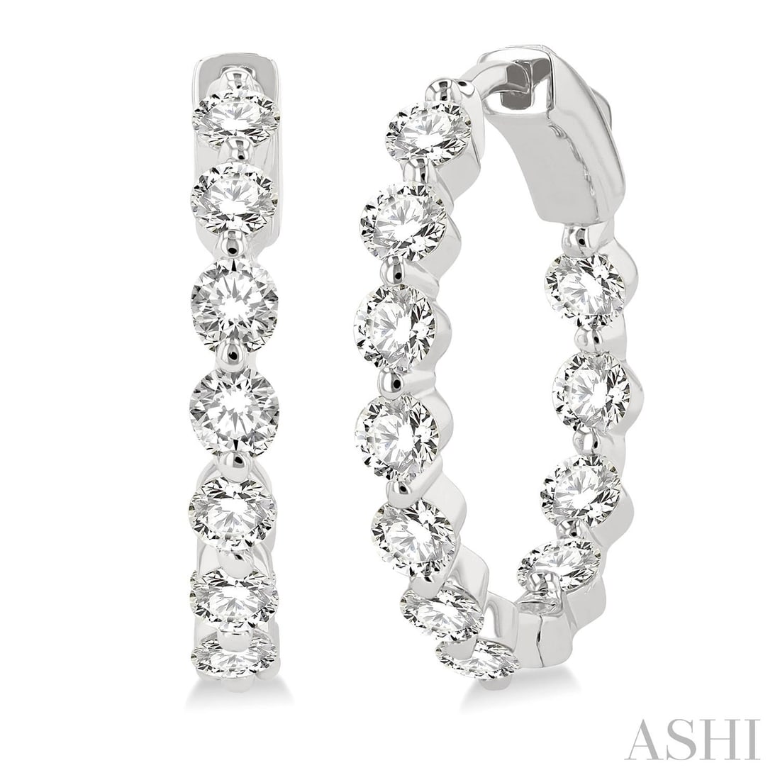 2.04 ctw Diamond Inside-Out 14K White Gold Hoop Earrings: An exquisite masterpiece of haute joaillerie, this breathtaking Inside-Out pair of earrings featuring Natural Diamonds is a true treasure. Showcasing the gems in a Shared Prong arrangement, the earrin