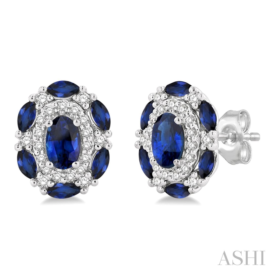 5x3mm Oval Blue Sapphire and 0.20 ctw Diamond 14K White Gold Earrings: Defining modern elegance, this stunning Halo pair of earrings featuring Blue Sapphire, White Diamond captures the essence of style. Expertly mounted in a Halo setting, the earrings are crafted in 2.1 