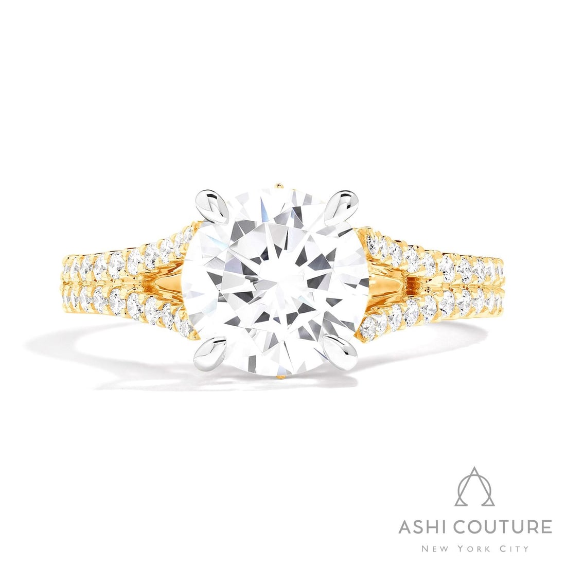 0.72 ctw White Diamond Split Shank 18K Yellow & White Gold Engagement Ring: Defining modern elegance, this magnificent Split Shank ring featuring White Diamond captures the essence of style. Securely held in a classic Split Shank design, the ring is forged from 4.4 g of high-
