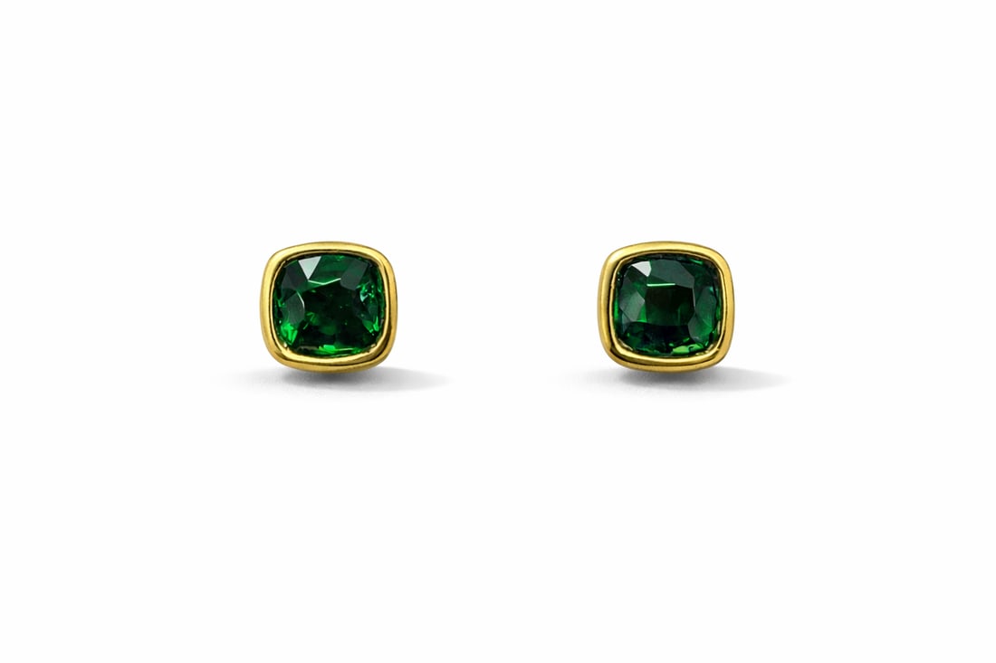 3.19ctw Tsavorite 18K Yellow Gold Studs Earrings: A testament to superior craftsmanship, this magnificent Bezel pair of earrings featuring Tsavorite is unparalleled. Showcasing the gems in a Bezel arrangement, the earrings consist of 2.91 grams of 18