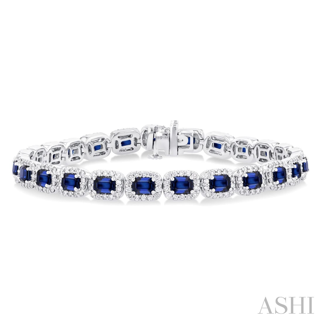 4x3mm Emerald Cut Blue Sapphire and 2.20 ctw Diamond 14K White Gold Bracelet: Exuding opulence and grace, this breathtaking Halo bracelet featuring Blue Sapphire, White Diamond is crafted for the distinguished. Showcasing the gems in a Halo arrangement, the bracelet consists of