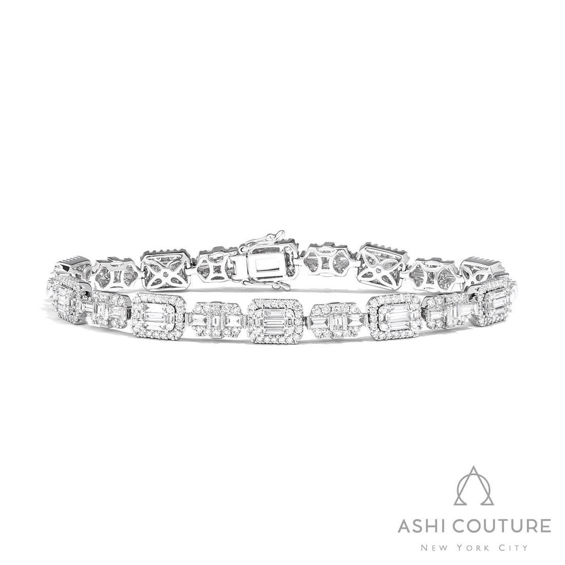4.65 ctw Empress Baguette & Round Diamond 18K White Gold Bracelet: A vision of luxury, this breathtaking Baguette Link bracelet featuring White Diamond defines sophistication. Securely held in a classic Cluster/Halo Link design, the bracelet is forged from 19.4 g of 