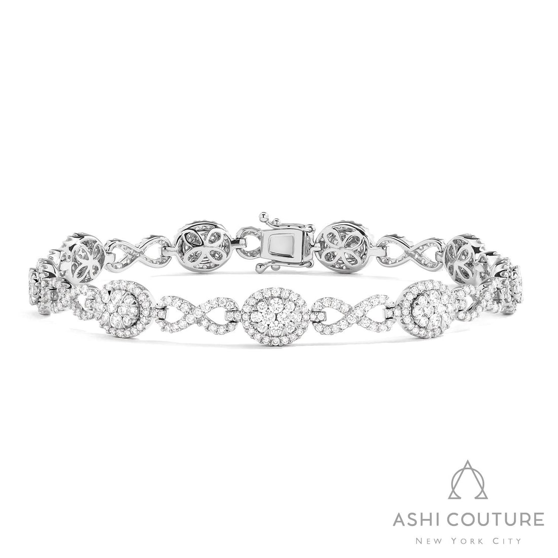 3.06 ctw White Diamond Fiori Infinity Alternating 18K White Gold Bracelet: Defining modern elegance, this breathtaking Fiori Oval And Infinity Alternating bracelet featuring White Diamond captures the essence of style. Expertly mounted in a Cluster setting, the bracelet is c