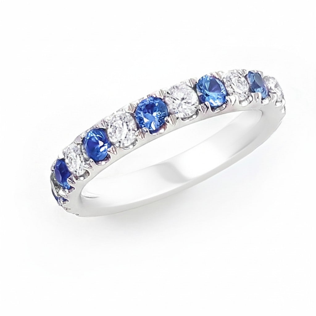 1.48ctw Alternating Sapphire and Diamond 14K White Gold Band Ring: Captured in a moment of brilliance, this magnificent Alternating Band ring featuring Blue Sapphire, White Diamond speaks to the connoisseur. Expertly mounted in a Shared Prong setting, the ring is cra