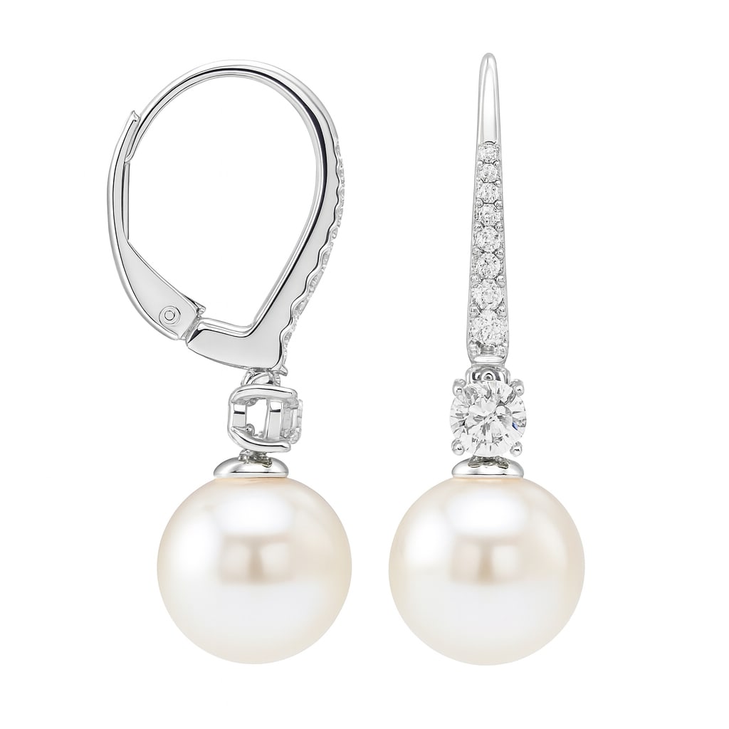 14k White Gold Earrings with Freshwater Pearls and Diamonds: Exuding elegance, these exquisite earrings feature lustrous Freshwater Pearls, complemented by sparkling Diamonds. The design showcases a harmonious blend of 14k White Gold and Rhodium, enhancing the 