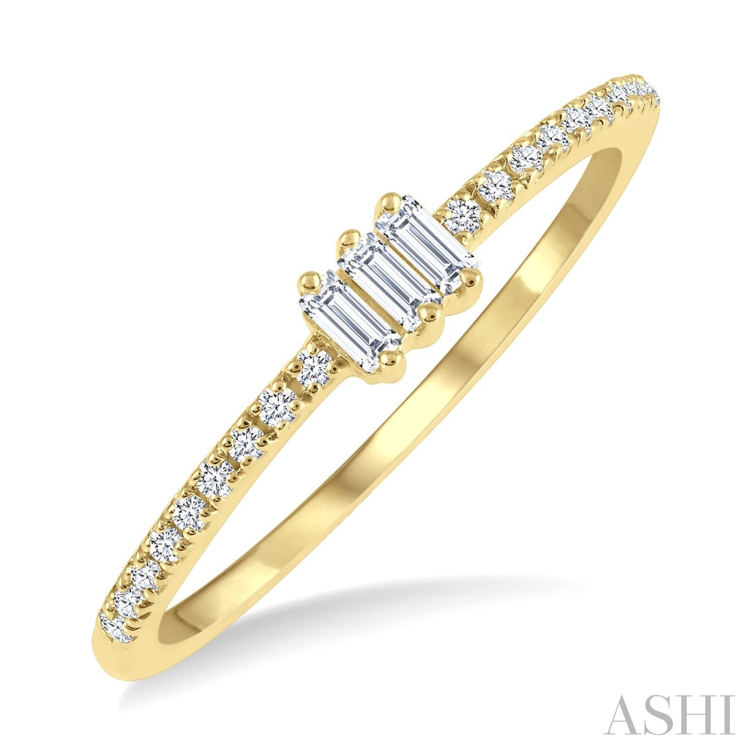 0.20 ctw Baguette & Round Diamond 10K Yellow Gold Ring: Rare and radiant, this elegant Petite Fashion ring featuring White Diamonds offers a touch of the extraordinary. Showcasing the gems in a Three-Stone arrangement, the ring consists of 1.46 grams of 10