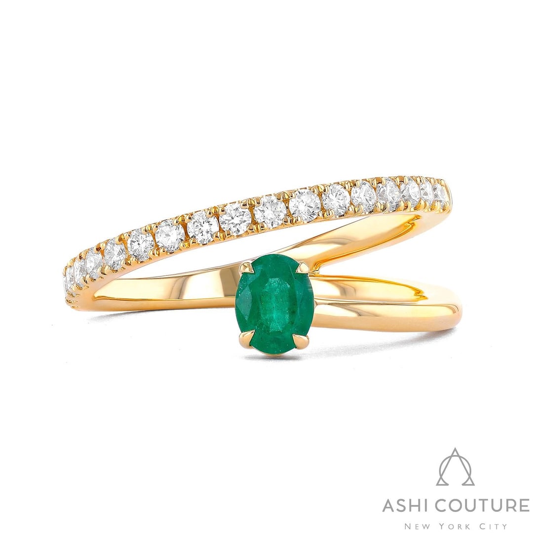 Emerald and 0.33 ctw Diamond 18k Yellow Gold Ring: Retail Value: $4,395 A testament to superior craftsmanship, this exquisite Vault Oval Shape ring featuring Emerald, White Diamond is unparalleled. Expertly mounted in a Bypass setting, the ring is cra