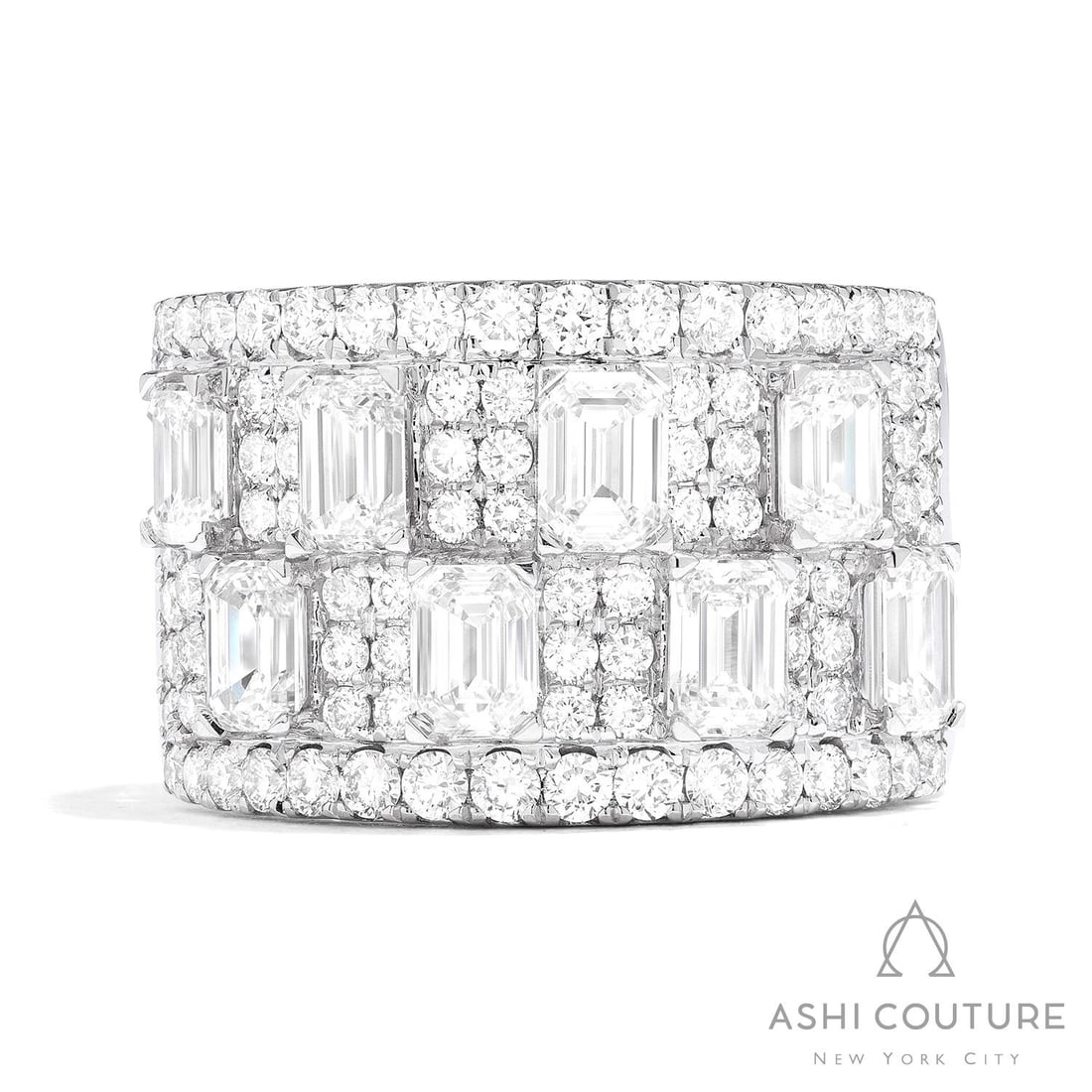3.81 ctw Emerald & Round Diamond Wide Band 18k White Gold Ring: Retail Value: $25,305 Defining modern elegance, this magnificent Wide Halfway Band ring featuring Natural White Diamond captures the essence of style. A detailed Multi-Row Band gallery secures the sto