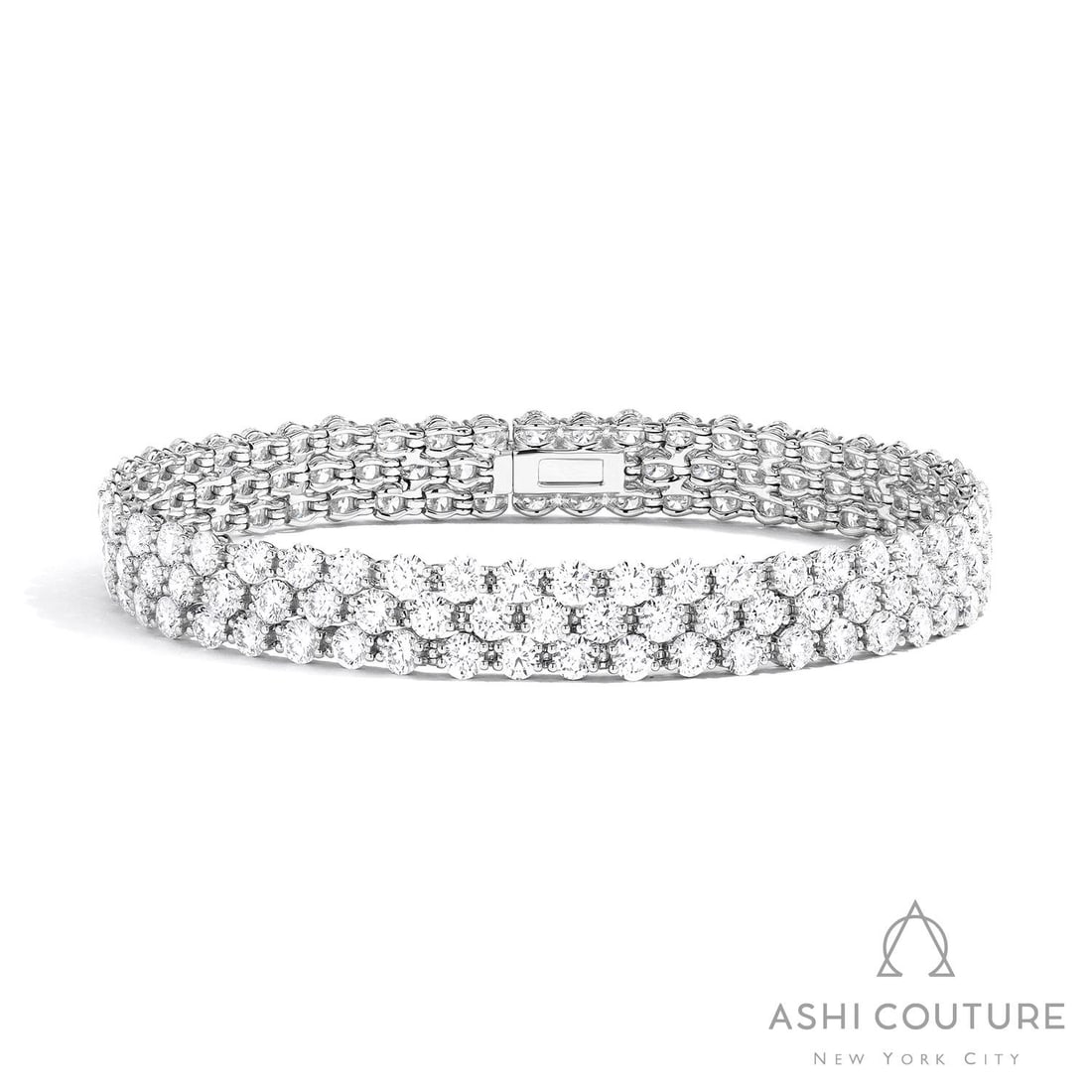 Duchess Three Row 12.74 ctw White Diamond Platinum Tennis Bracelet: A symphony of light and color, this breathtaking Three Row bracelet featuring Natural Diamonds embodies the pinnacle of luxury. Securely held in a classic Link/Prong Setting design, the bracelet is fo