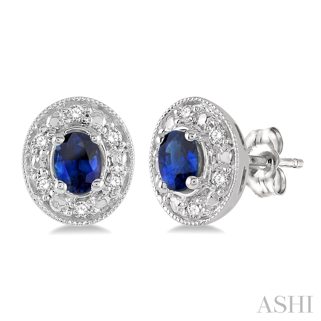 4x3mm Oval Sapphire and 0.10 ctw Diamond 14K White Gold Earrings: An exquisite masterpiece of haute joaillerie, this elegant Oval Shaped pair of earrings featuring Blue Sapphire, White Diamond is a true treasure. Crafted with precision, the Halo setting is seamlessl