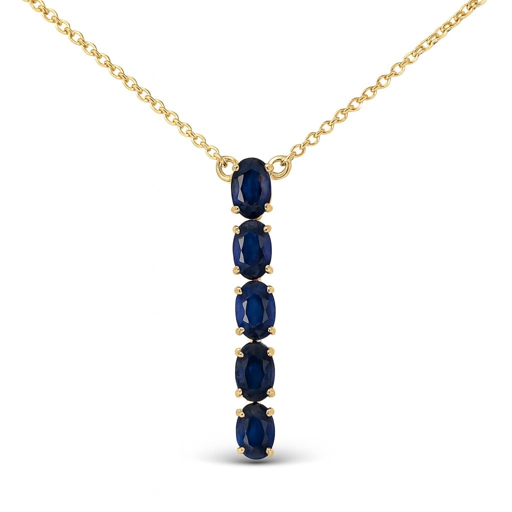 2.10ctw Oval Blue Sapphire Straight Line 14K Yellow Gold Pendant: Epitomizing grandeur, this exquisite Straight Line pendant featuring Blue Sapphire stands as a beacon of refined taste. Showcasing the gems in a Straight Line arrangement, the pendant consists of 3.0 