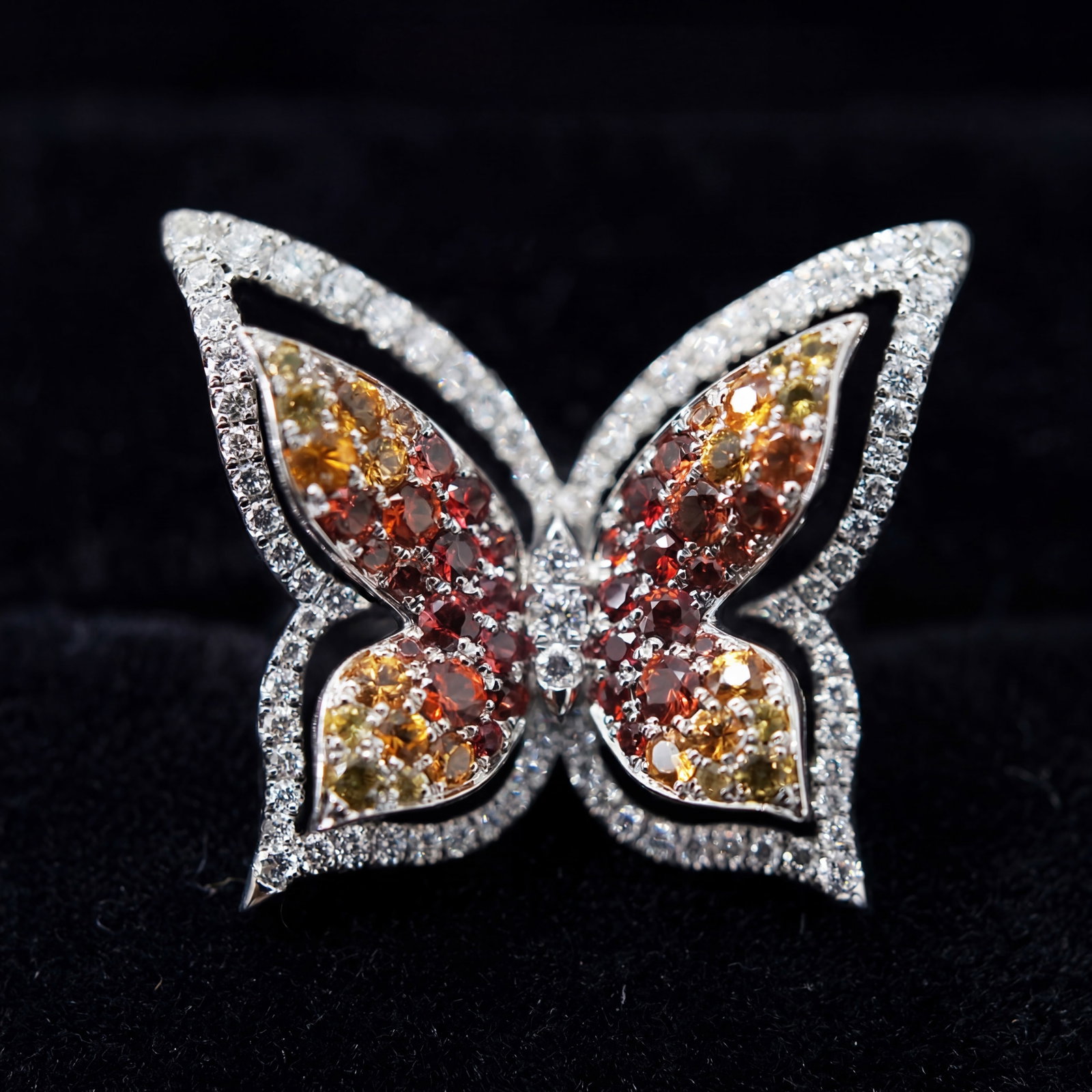 2.20 ctw Yellow Sapphire and 0.75 ctw White Diamond Platinum Ring: Retail Value: $8,625 Epitomizing grandeur, this breathtaking Butterfly ring featuring Yellow Sapphire, Blue Sapphire, White Diamond stands as a beacon of refined taste. A detailed Pave gallery secures