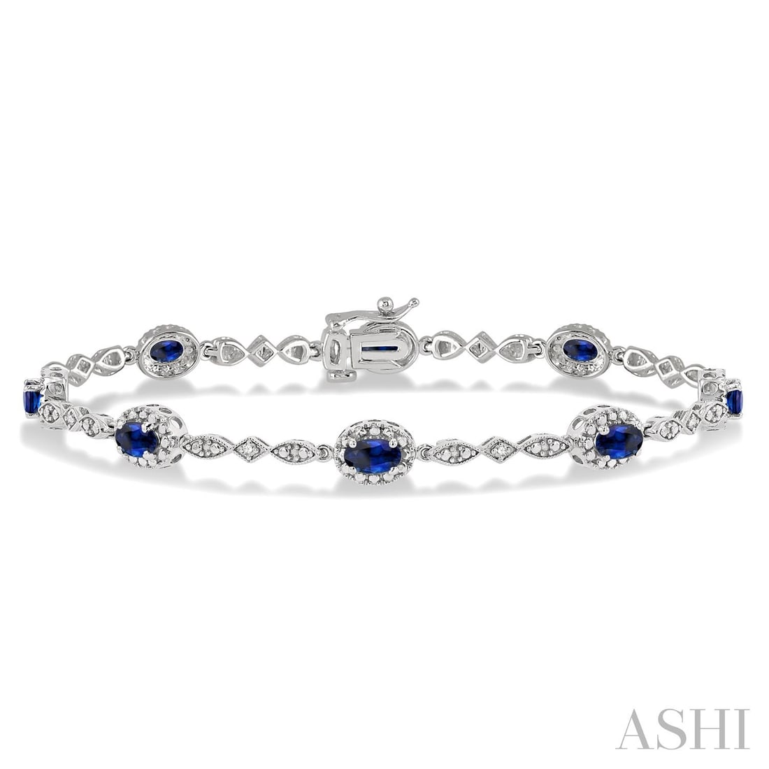 5x3mm Oval Blue Sapphire and 0.05 ctw Diamond 10K White Gold Bracelet: Rare and radiant, this exquisite Halo bracelet featuring Blue Sapphire, White Diamond offers a touch of the extraordinary. A detailed Prong gallery secures the stones, rendered in 5.1 grams of lustrou