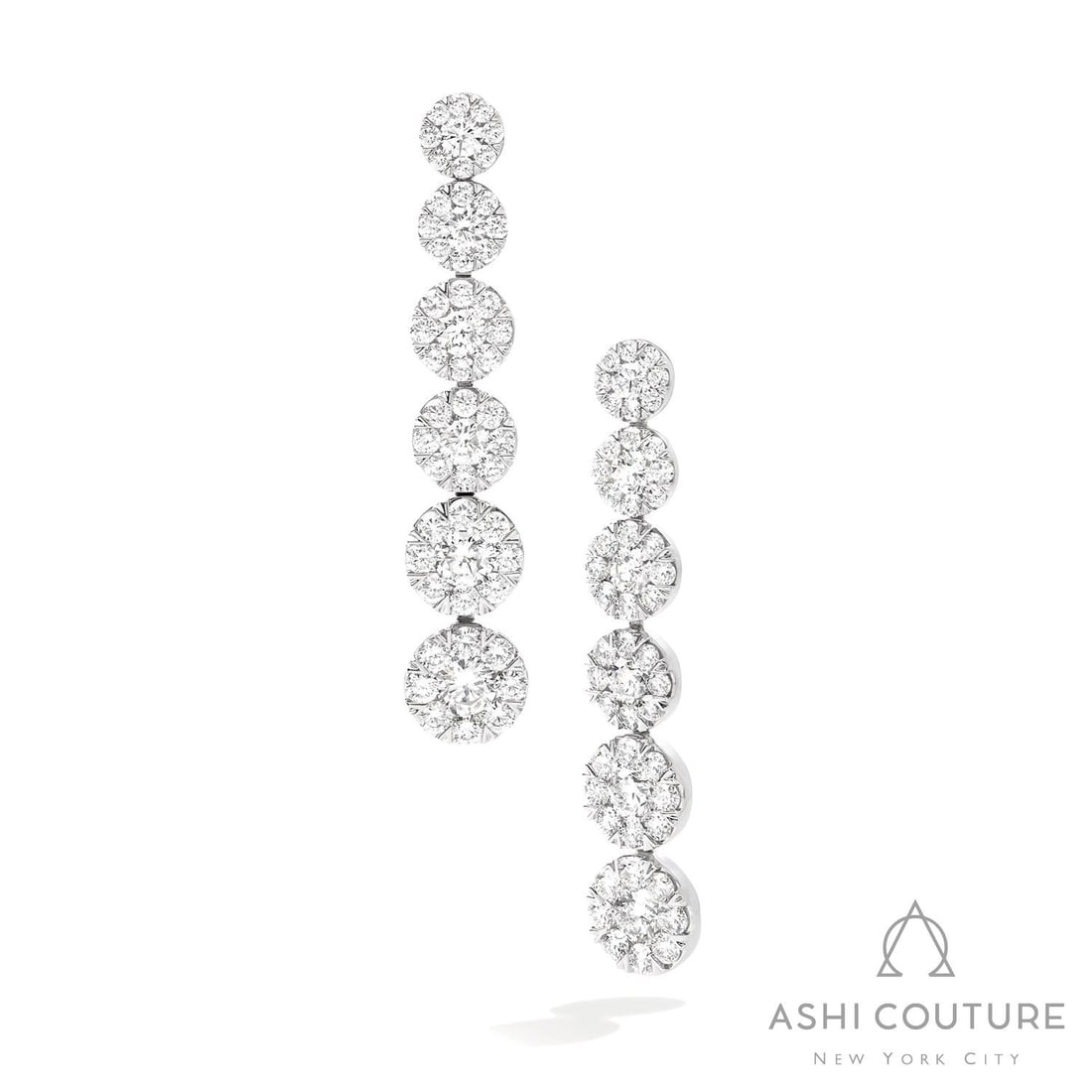 5.23 ctw Fiori White Diamond Cluster 18K White Gold Earrings: Epitomizing grandeur, this magnificent Graduating Drop Cluster pair of earrings featuring White Diamond stands as a beacon of refined taste. Crafted with precision, the Cluster setting is seamlessly i