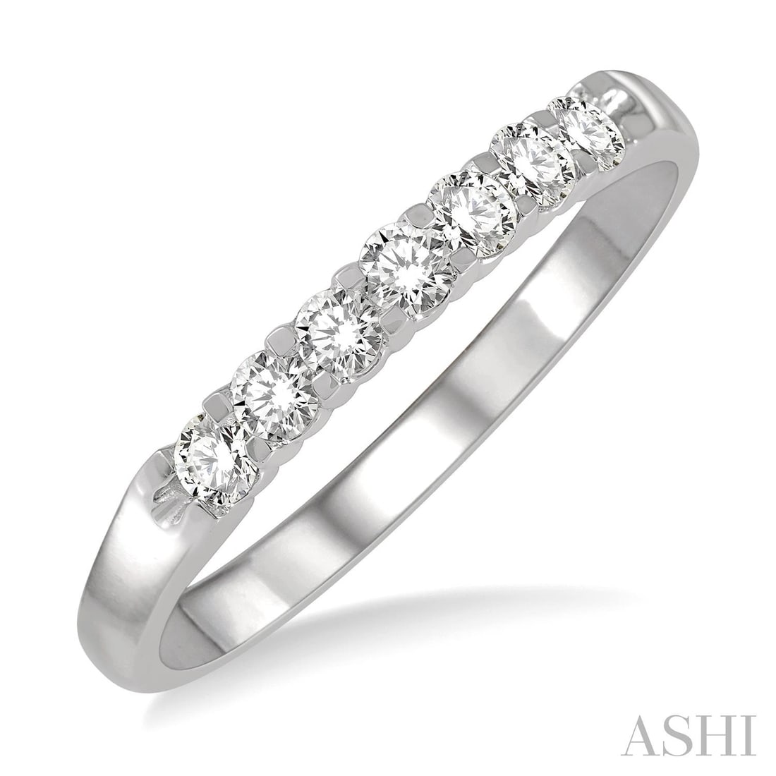 0.25 ctw Diamond 7 Stone Wedding Band 14K White Gold: Exuding opulence and grace, this elegant 7 Stone ring featuring Natural Diamonds is crafted for the distinguished. Crafted with precision, the Shared Prong Line Setting is seamlessly integrated into 2