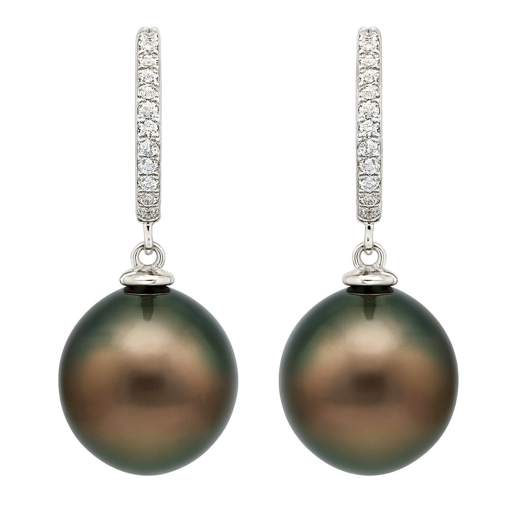 14k White Gold Pearl Earrings with Diamonds 0.08ct: A harmonious blend of elegance and sophistication, this exquisite pair of earrings features lustrous pearls as the main attraction. Accentuated by sparkling diamonds, each stone is set in a sleek, mod