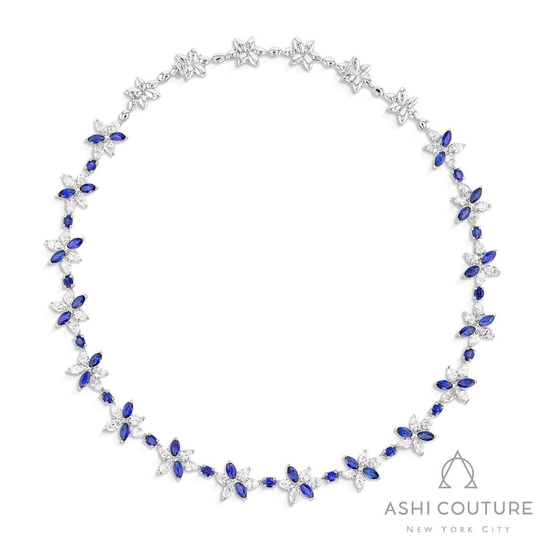 16 inch Blue Sapphire and 11.96 ctw White Diamond Platinum Necklace: An exquisite masterpiece of haute joaillerie, this magnificent Floral necklace featuring Blue Sapphire, White Diamond is a true treasure. Showcasing the gems in a Cluster arrangement, the necklace con