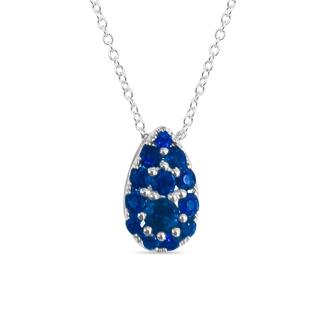0.98ctw Blue Sapphire 14K White Gold Pendant: Defining modern elegance, this stunning Pear Shape Link pendant featuring Blue Sapphire captures the essence of style. The gemstones are nestled within a Cluster framework, supported by a substantial 