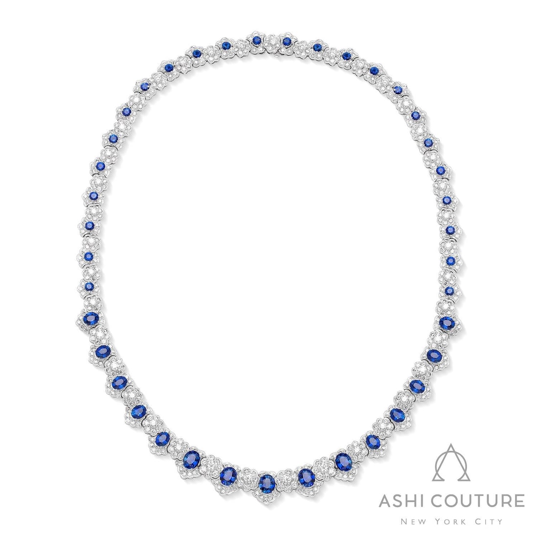 11.24 ctw Blue Sapphire and Diamond 18K White Gold Necklace: Epitomizing grandeur, this magnificent Regal necklace featuring Blue Sapphire, White Diamond stands as a beacon of refined taste. Crafted with precision, the Halo setting is seamlessly integrated into