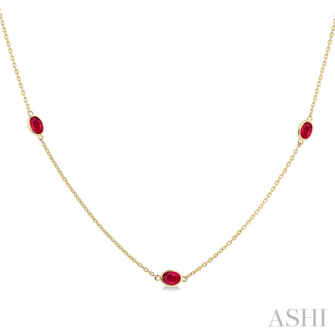 4x3mm Oval Ruby Bezel Station 14k Yellow Gold Necklace: A vision of luxury, this elegant Station necklace featuring Ruby defines sophistication. Securely held in a classic Bezel design, the necklace is forged from 2.45 grams of high-polish 14K Yellow Gold.