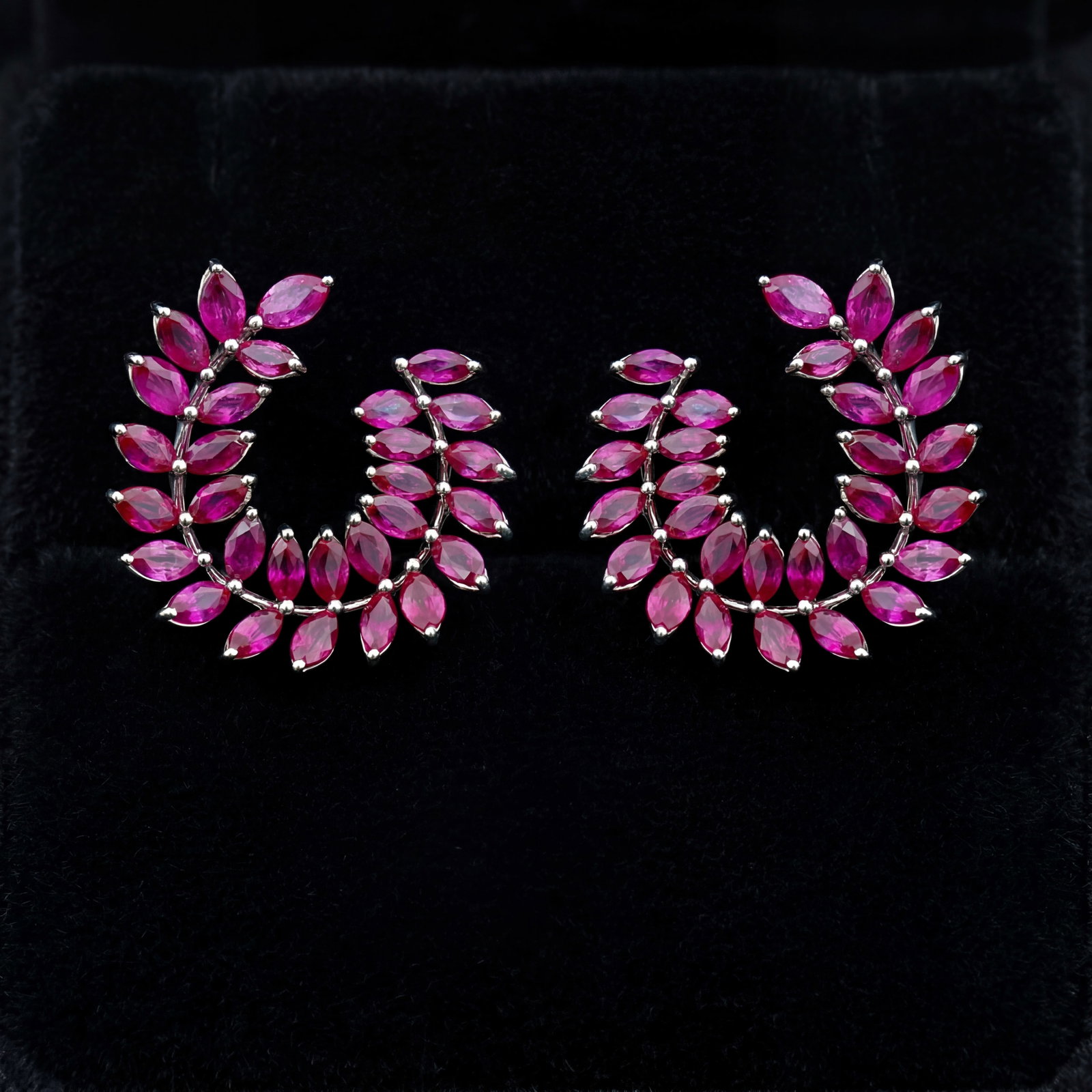 6.7 ctw Ruby Leaf Platinum Earrings: Retail Value: $9,345 Captured in a moment of brilliance, this stunning Leaf pair of earrings featuring Ruby speaks to the connoisseur. Expertly mounted in a Cluster setting, the earrings are crafted i