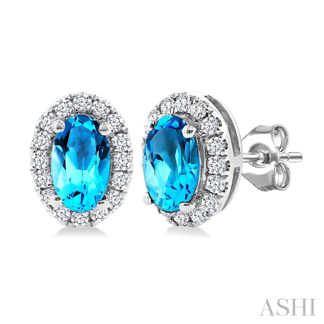 5x3mm Blue Topaz and 0.14 ctw Diamond 14K White Gold Stud Earrings: Defining modern elegance, this elegant Halo pair of earrings featuring Blue Topaz, White Diamond captures the essence of style. Expertly mounted in a Halo setting, the earrings are crafted in 0.85 gra