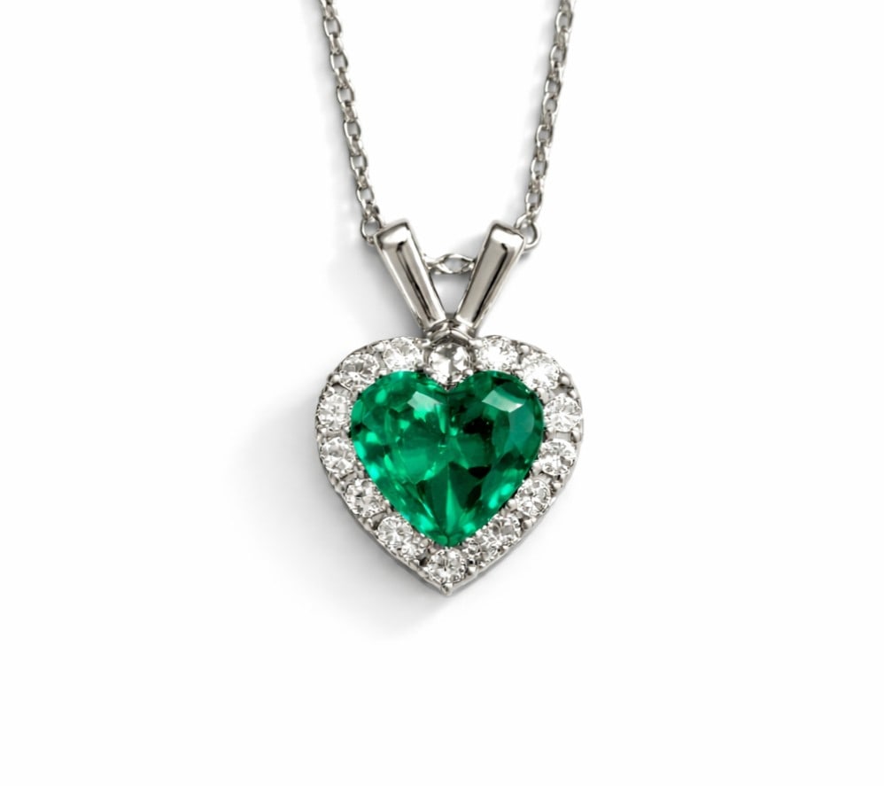 1.47ct Emerald and 0.50ctw Diamond Halo 14K White Gold Pendant: An exquisite masterpiece of haute joaillerie, this stunning Halo pendant featuring Emerald, White Diamond is a true treasure. A detailed Halo gallery secures the stones, rendered in lustrous 14K White