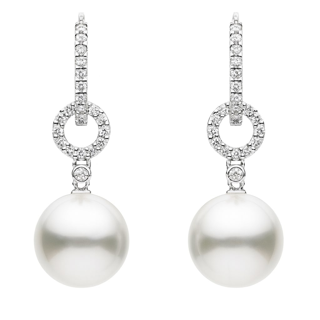 18k White Gold Earrings with South Sea Pearls and Diamonds: A harmonious blend of elegance and sophistication, this exquisite pair of earrings features lustrous South Sea Pearls as the centerpiece. Each pearl is suspended from a circle of sparkling Diamonds, t