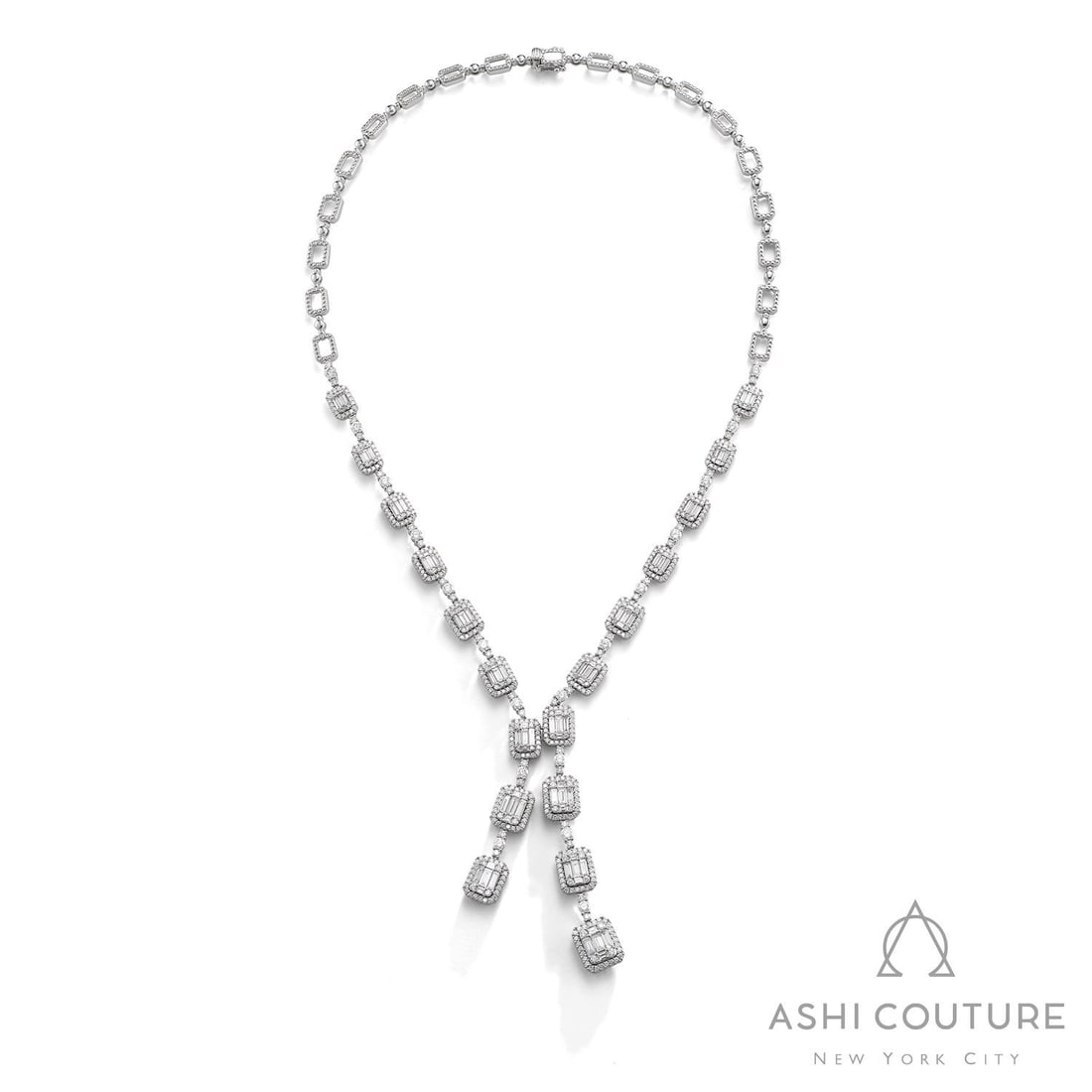 8.83 ctw Baguette & Round Diamond Split Empress 18K White Gold Necklace: A symphony of light and color, this exquisite Split necklace featuring White Diamond embodies the pinnacle of luxury. Expertly mounted in an Articulated Halo Links (Lariat Style) setting, the necklace