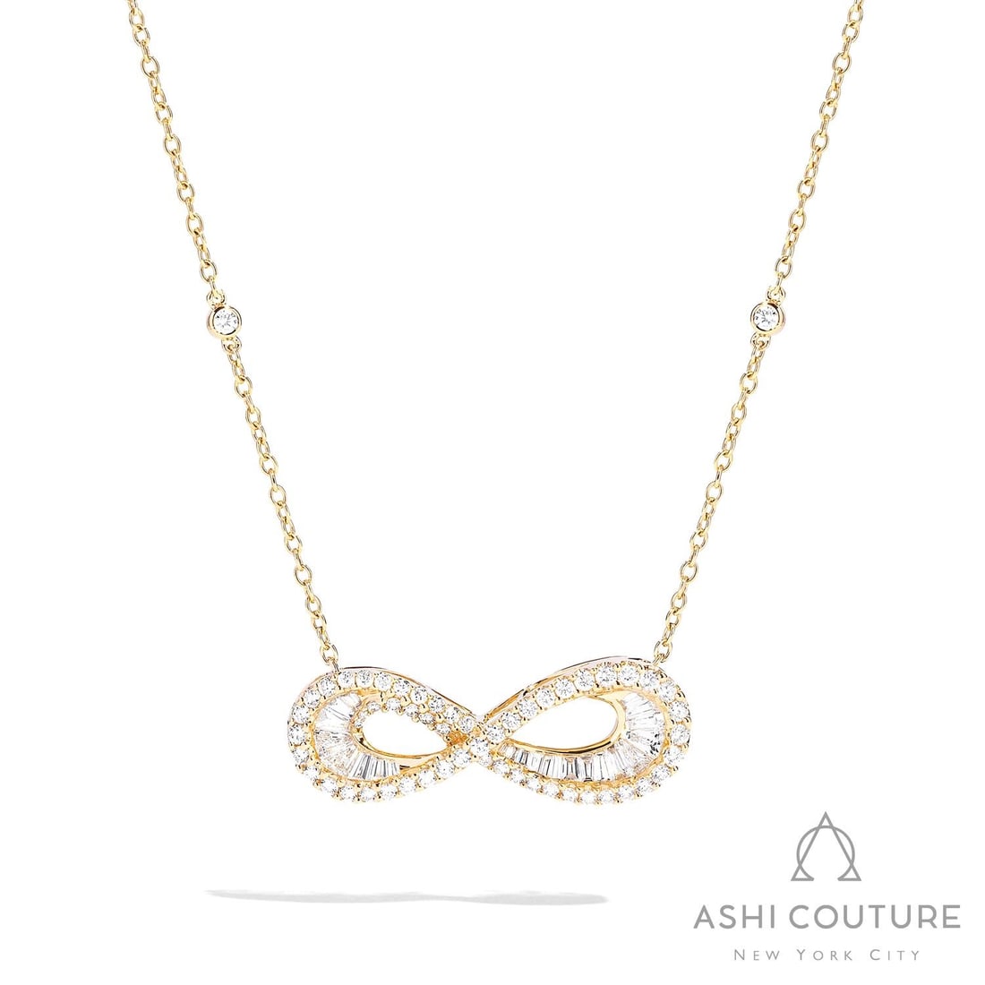 1.68 ctw Diamond Infinity Baguette 18K Yellow Gold Pendant Necklace: Captured in a moment of brilliance, this breathtaking Infinity Baguette necklace featuring White Diamond speaks to the connoisseur. Expertly mounted in a Halo setting, the necklace is crafted in 4.6 g