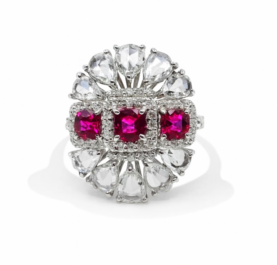 4.24ctw Ruby and 2.93ctw Diamond Platinum Ring: Defining modern elegance, this stunning Halo ring featuring Ruby, White Diamond captures the essence of style. Expertly mounted in a Cluster setting, the ring is crafted in solid Platinum. This ring s