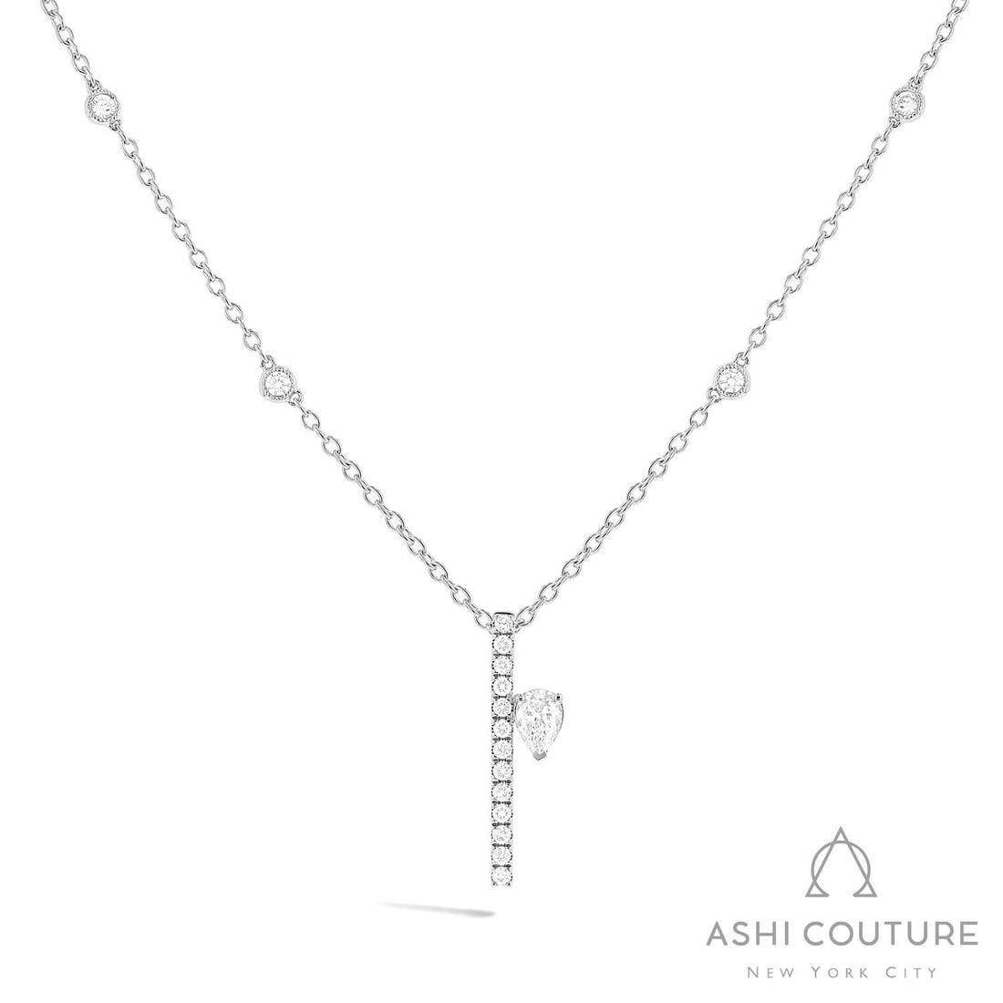 0.71 ctw Pear Diamond Paradox Drift 18K White Gold Pendant Necklace: Epitomizing grandeur, this breathtaking Paradox Drift pendant necklace featuring White Diamond stands as a beacon of refined taste. Showcasing the gems in a Asymmetrical Drop/Bar Pendant arrangement, 