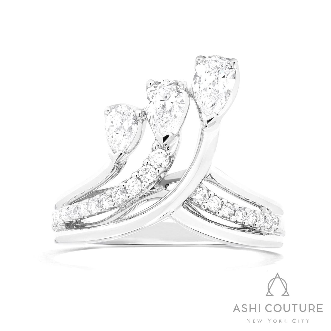 1.05 ctw Pear & Round Diamond Paradox Crown 18K White Gold Ring: A symphony of light and color, this magnificent Crown ring featuring White Diamond embodies the pinnacle of luxury. Expertly mounted in a Bypass/Crossover setting, the ring is crafted in 6.85 grams of