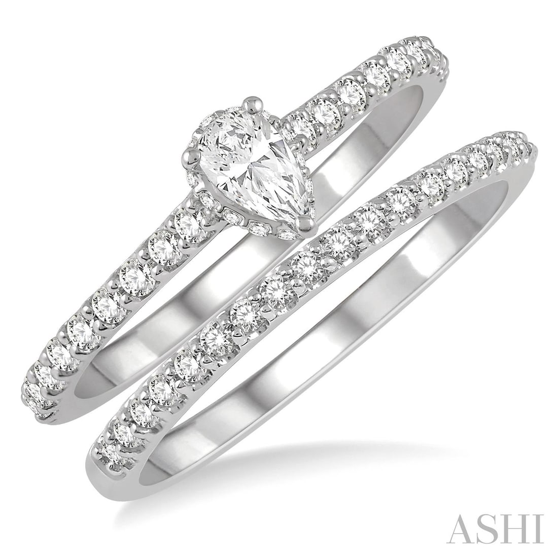 0.61 ctw Pear Cut Diamond Halo Wedding Set 14K White Gold: Defining modern elegance, this stunning Halo Wedding Set featuring White Diamond captures the essence of style. Expertly mounted in a Halo setting, the jewelry set is crafted in 3.35 grams of solid 14