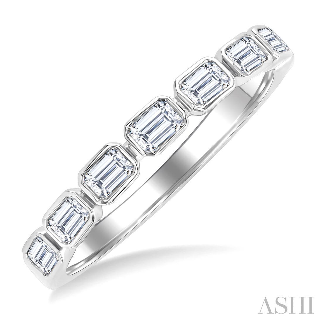 0.70 ctw Emerald Cut Diamond Bezel East-West 14K White Gold Band Ring: A symphony of light and color, this stunning East-West Emerald Cut Bezel band ring featuring White Diamond embodies the pinnacle of luxury. Securely held in a classic Bezel design, the ring is forged 