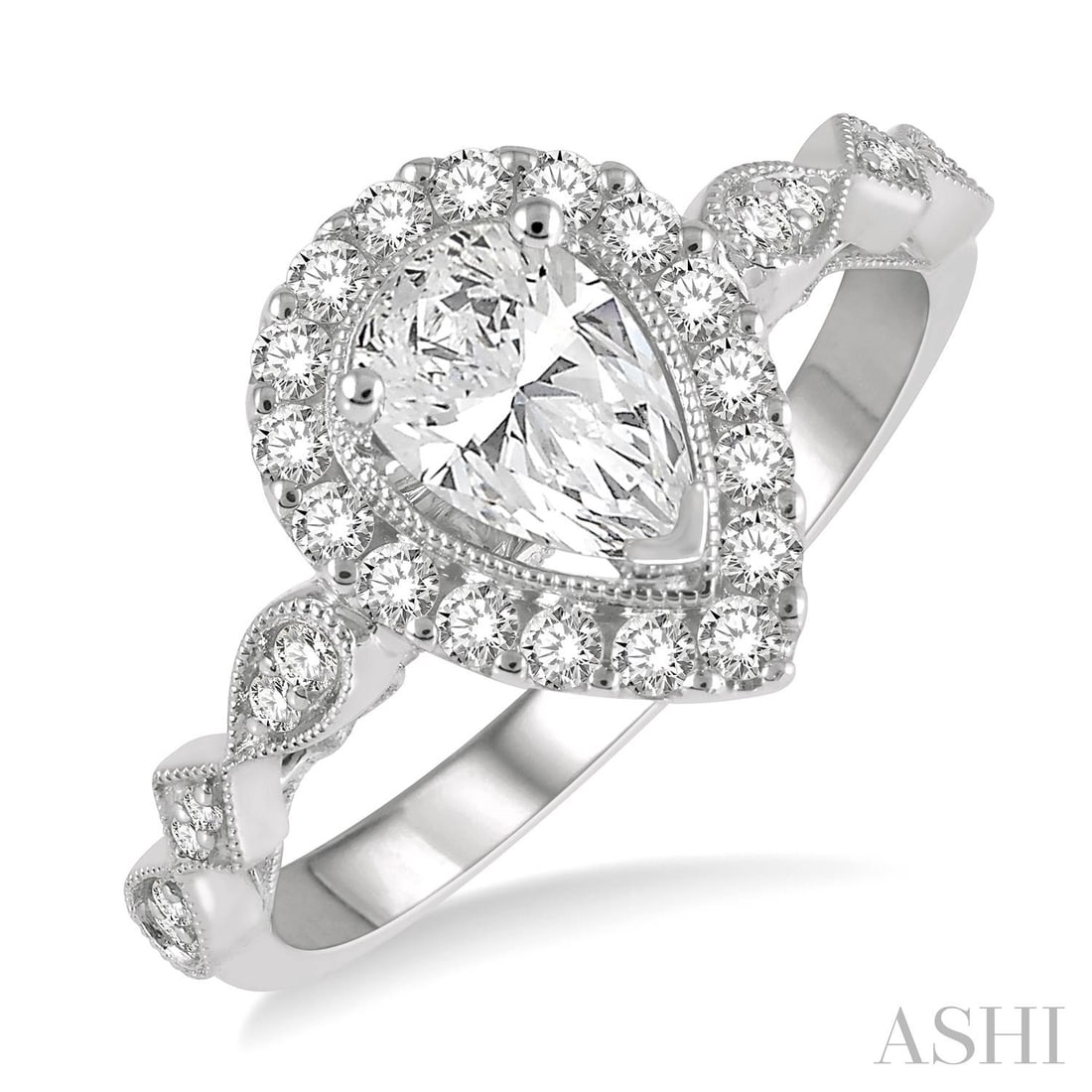 0.74 ctw Pear Diamond Carved Shank Engagement Ring 14K White Gold: Timeless and sophisticated, this stunning Carved Shank ring featuring White Diamond radiates enduring beauty. The gemstones are nestled within a Halo framework, supported by a substantial 3.0 grams 14