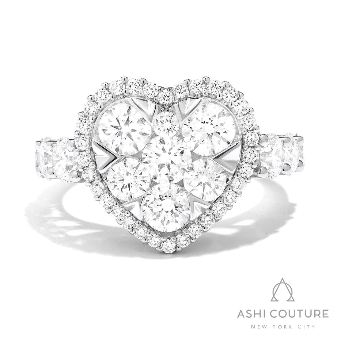 3.02 ctw Diamond Fiori Heart Cluster 18K White Gold Cocktail Ring: An exquisite masterpiece of haute joaillerie, this breathtaking Fiori Heart Cluster ring featuring White Diamond is a true treasure. A detailed Cluster gallery secures the stones, rendered in 7.0 gram