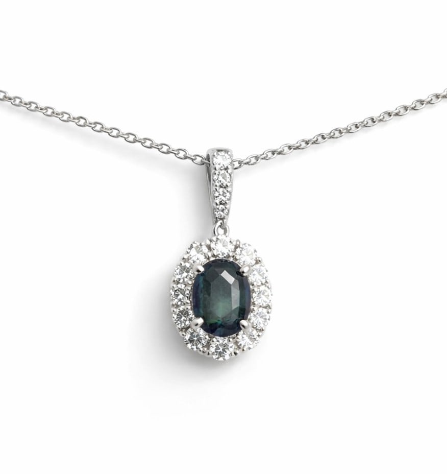 0.39ct Oval Alexandrite and 0.17ctw Diamond 18K White Gold Pendant: A vision of luxury, this breathtaking Halo pendant featuring Alexandrite, White Diamond defines sophistication. The gemstones are nestled within a Halo framework, supported by a substantial 0.69 grams