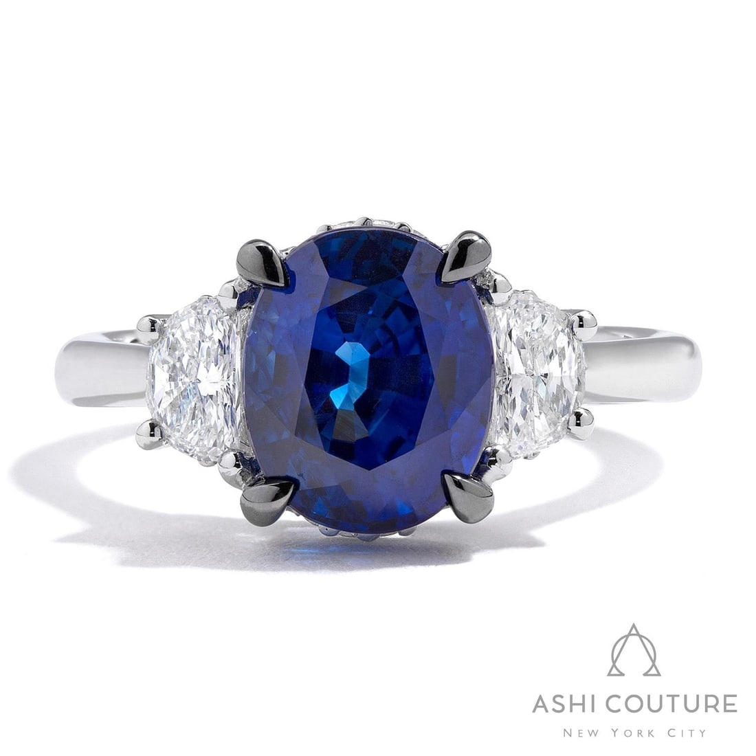 Three Stone Blue Sapphire and 0.63 ctw Diamond Platinum Ring: Retail Value: $39,045 Exuding opulence and grace, this magnificent Three Stone Oval Shape ring featuring Blue Sapphire, White Diamond is crafted for the distinguished. Expertly mounted in a Three-Ston